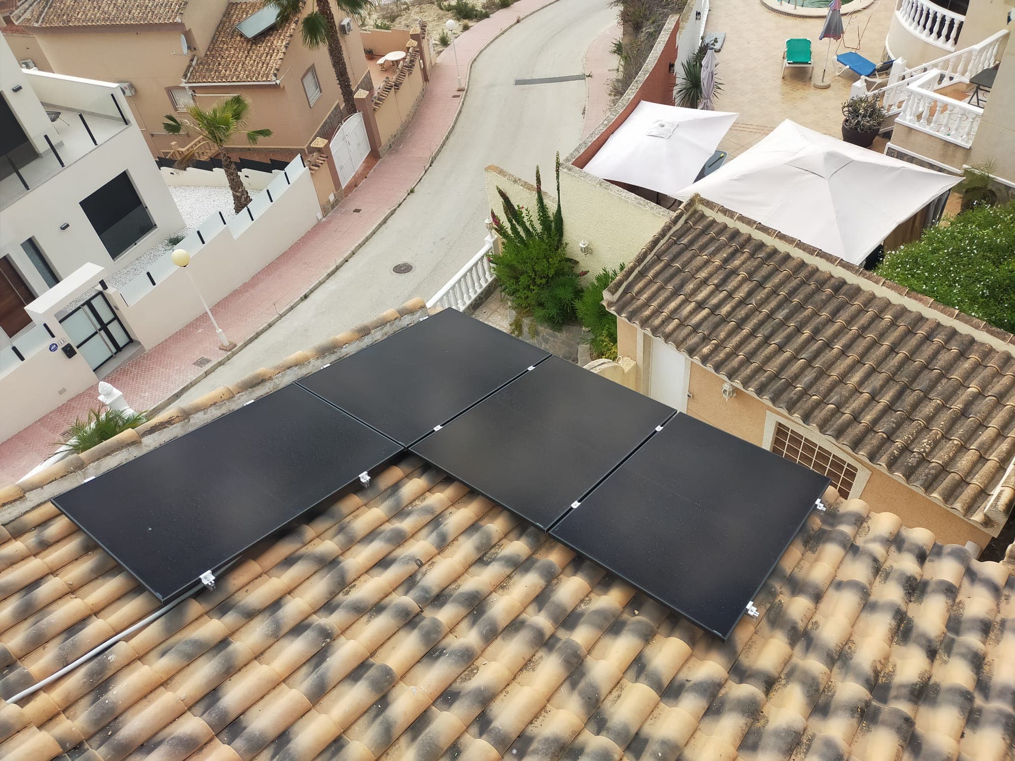 Solar panels on a tiled roof, seen from above