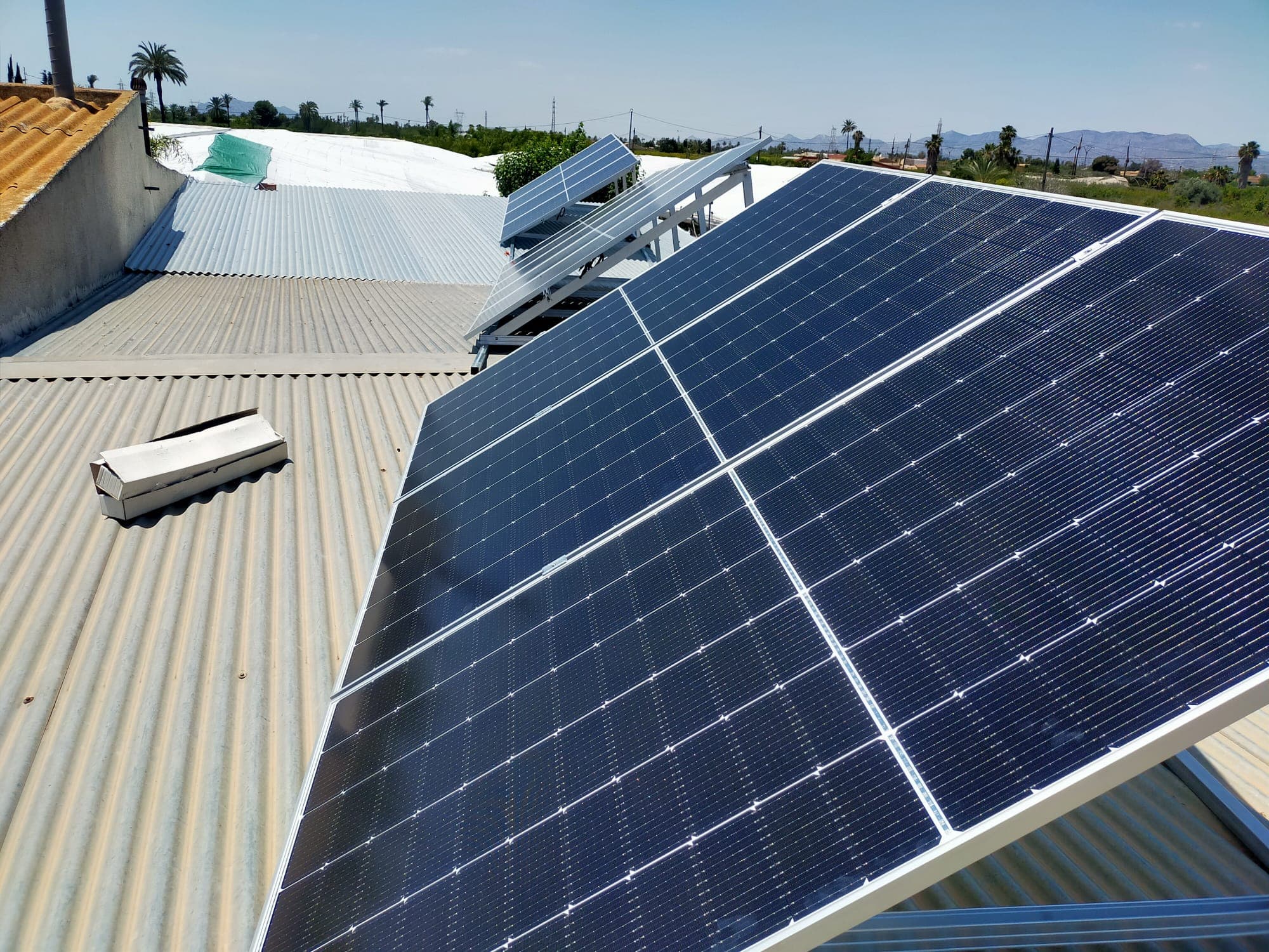 Solar panels on a flat roof with a sea view